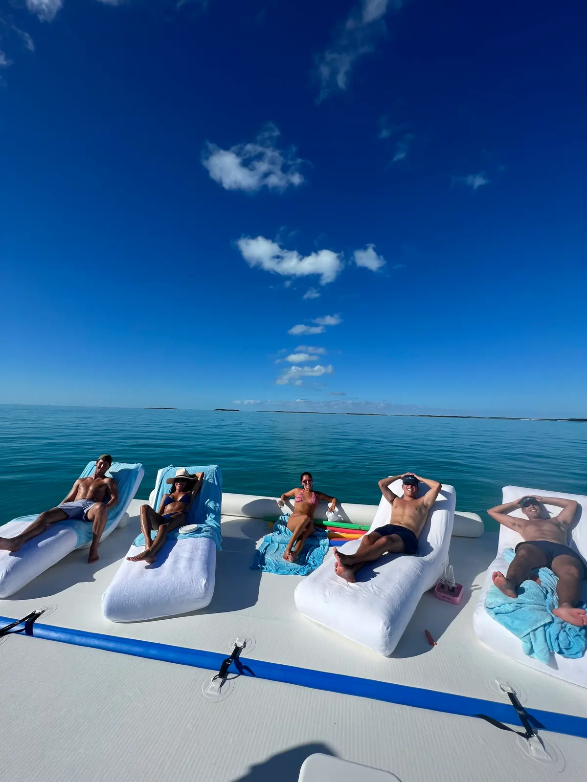 Loungers on the floating platform off the back of the boat